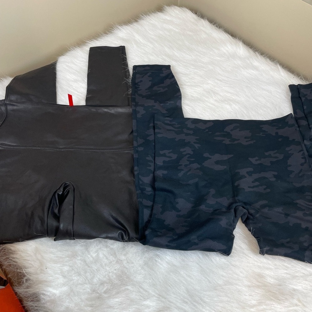 Two pairs Spanx Leggings Large Black Leather look and Blur Camouflage